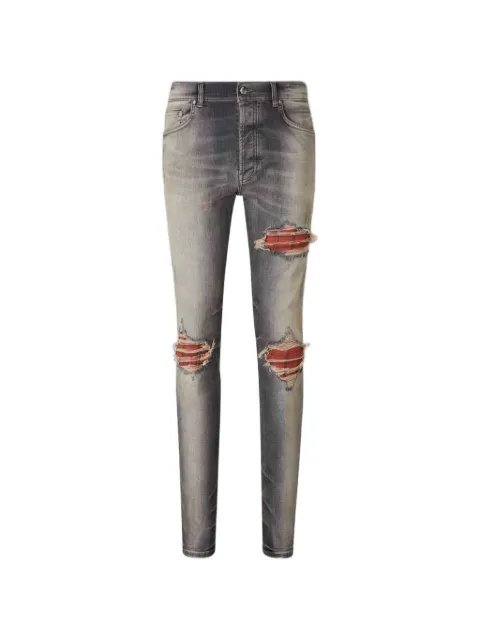 AMIRI distressed checked-panel jeans