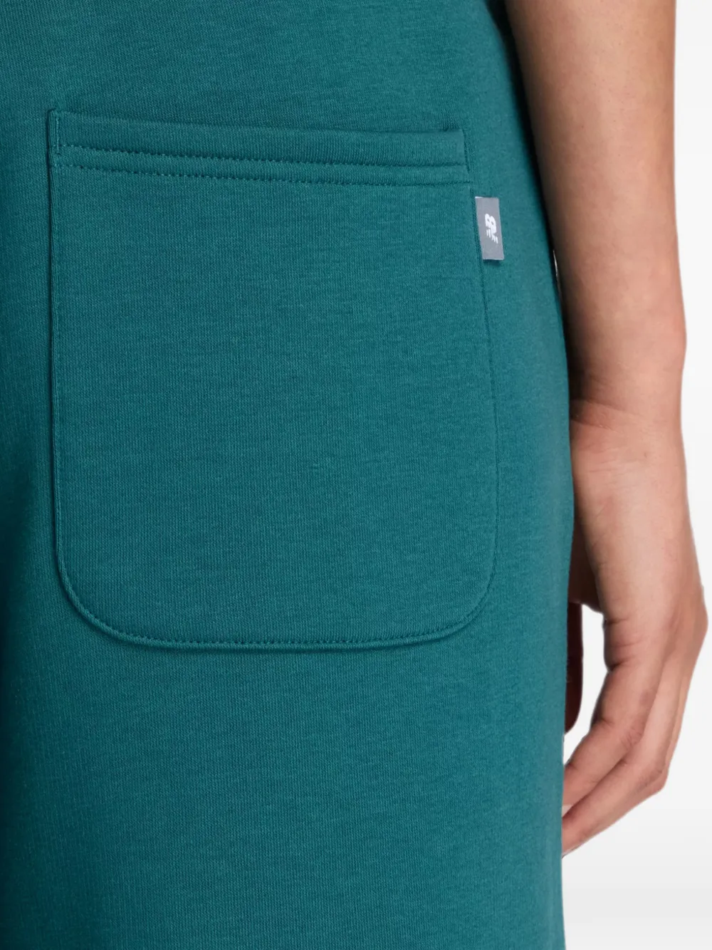New Balance Trackside fleece broek Groen