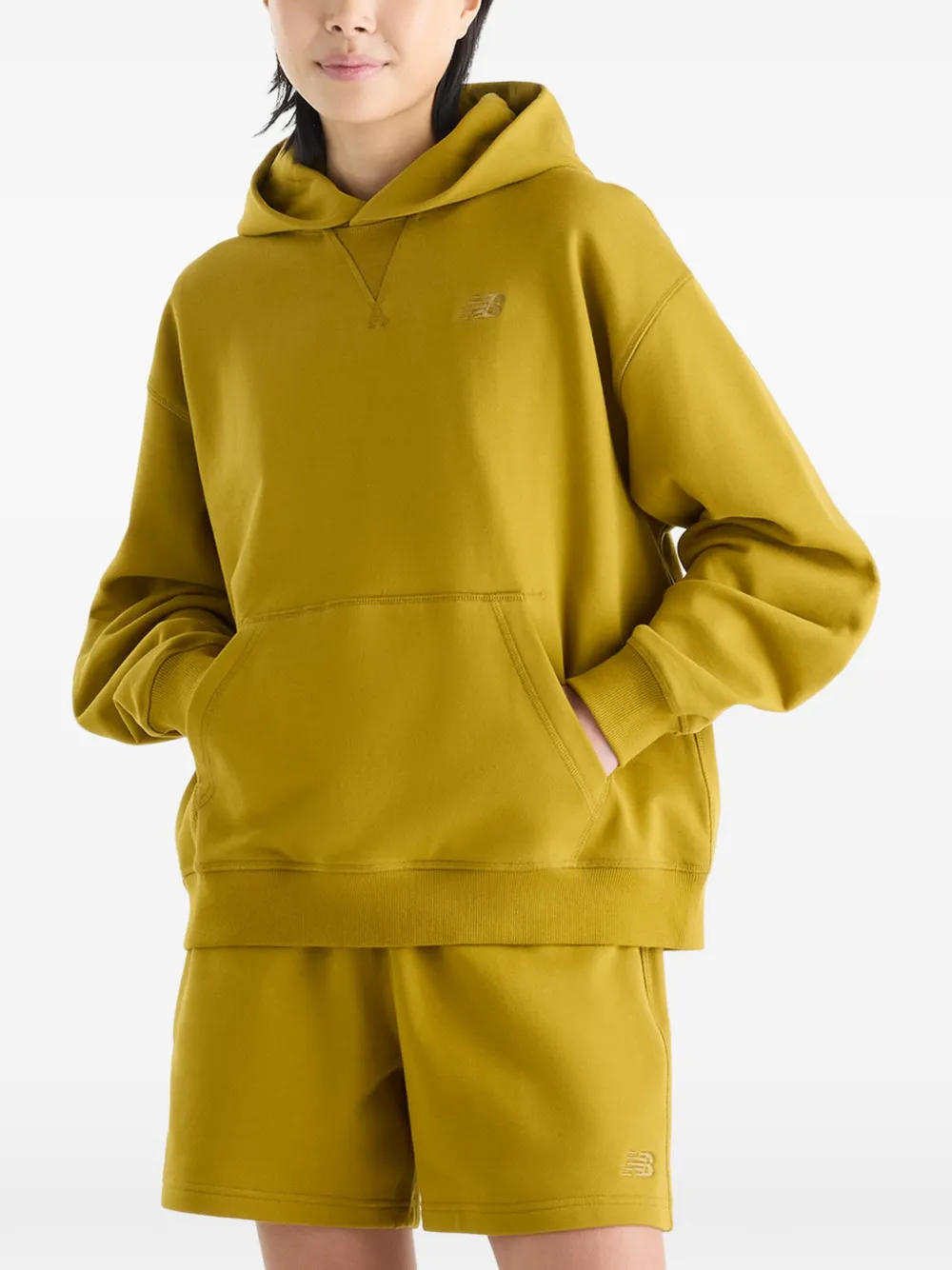 New Balance Athletics sweatstof hoodie Geel