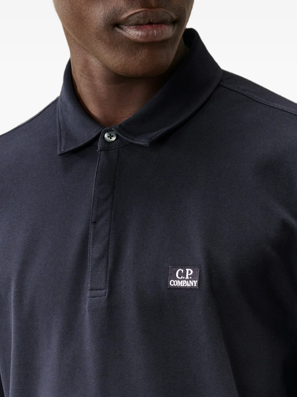 C.P. Company Stretch piquet poloshirt met lange mouwen en één knoop Blauw