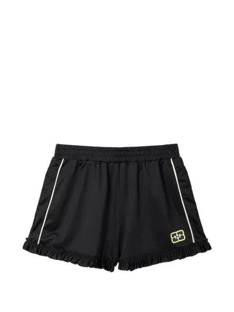 GANNI pantalones cortos con ribete de volantes
