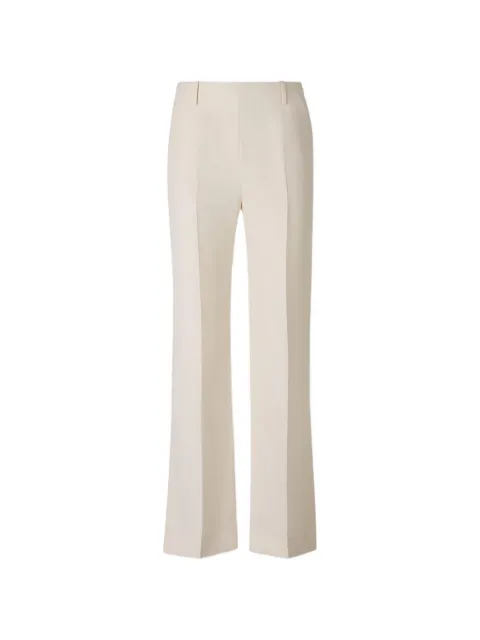 KHAITE pressed-crease slit-hem trousers