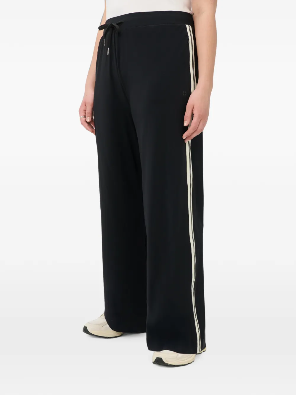 Sweaty Betty Explorer trainingsbroek met zijstreep en wijde pijpen Zwart