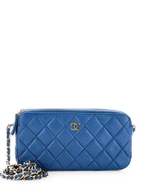 CHANEL Pre-Owned bolso de mano de piel de borrego acolchado con doble cremallera y cadena