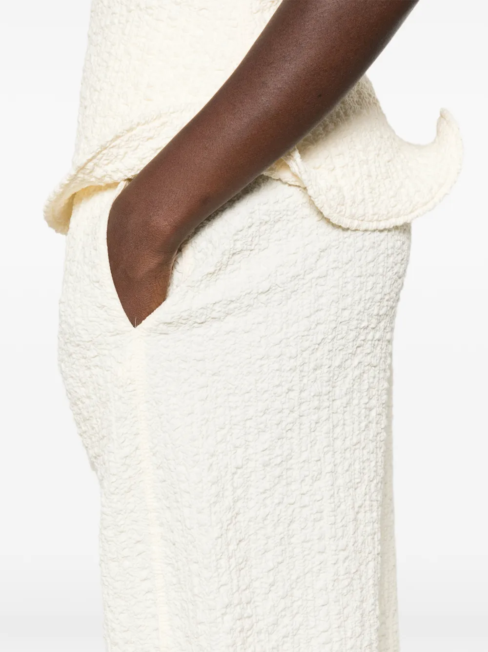 Nanushka Broek met wijde pijpen en seersucker-effect Beige