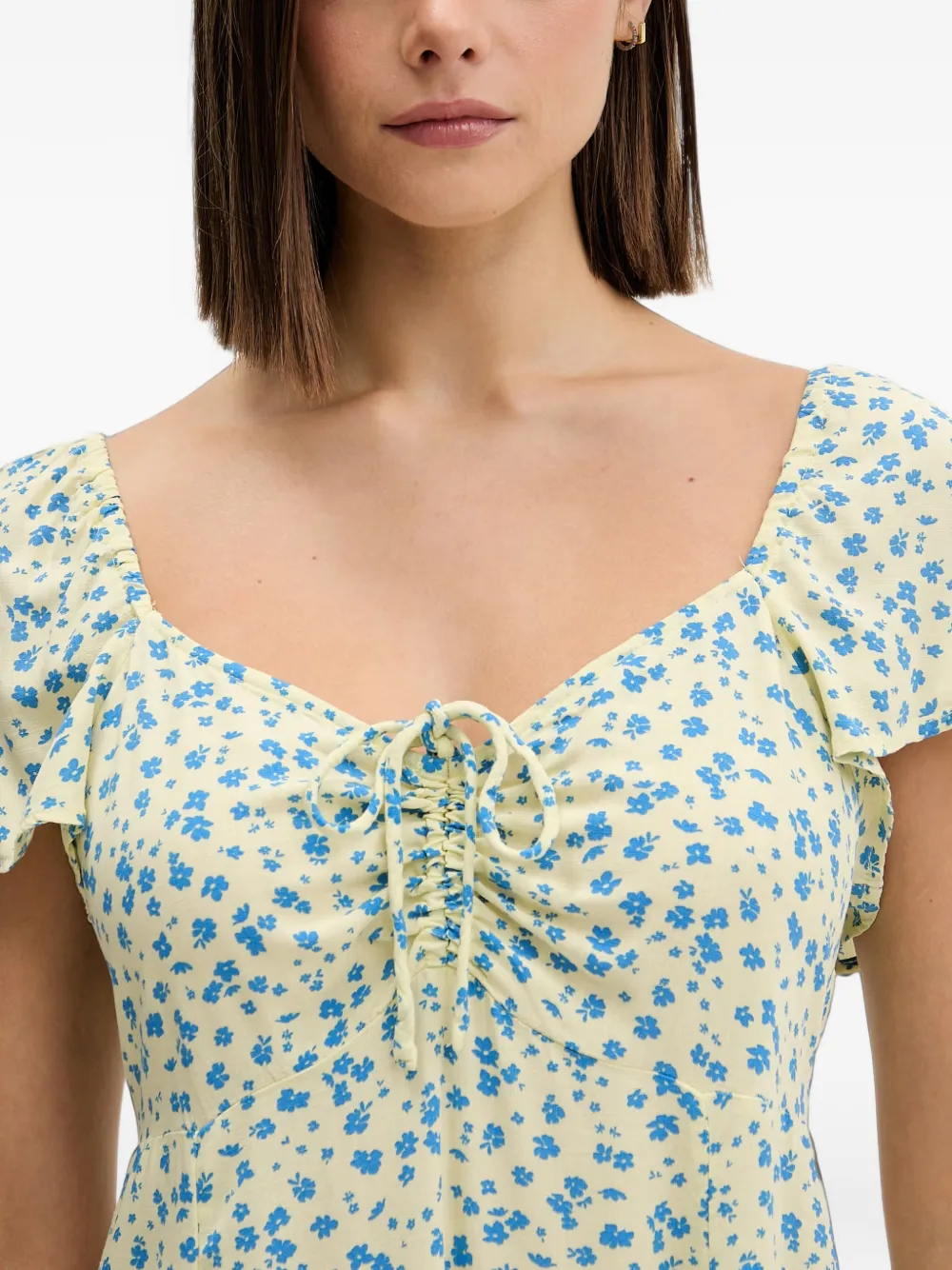 Rip Curl Mini-jurk met bloemen-print en striksluiting aan de voorkant Geel