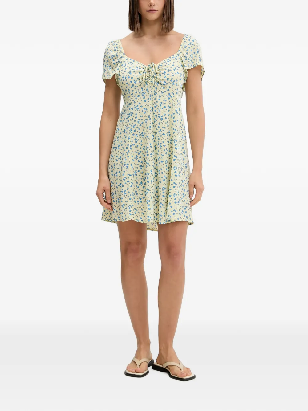 Rip Curl Mini-jurk met bloemen-print en striksluiting aan de voorkant Geel