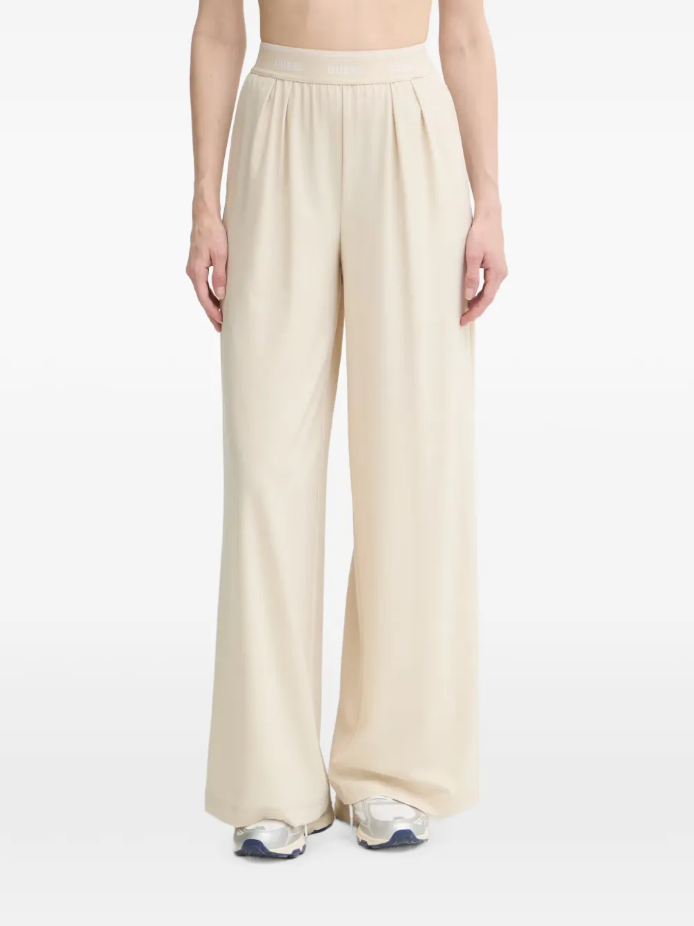 GUESS USA logo-waistband pleated trousers - Toni neutri