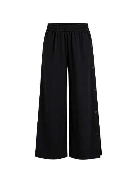 Arlo Mott Baxter side-buttons trousers