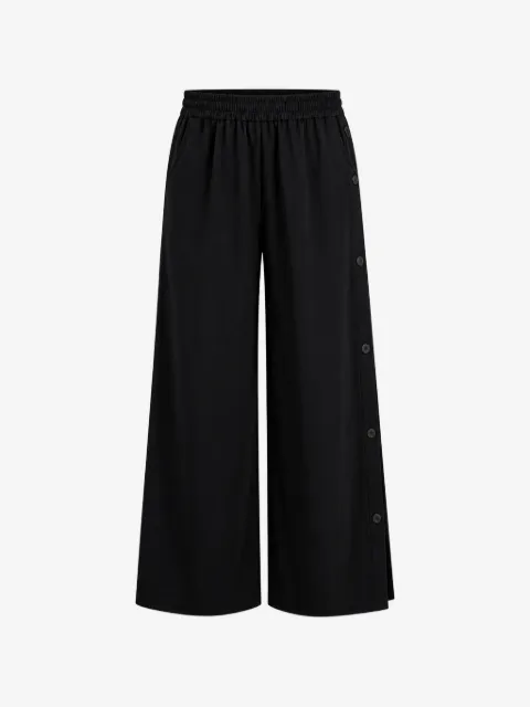 Arlo Mott Baxter side-buttons trousers