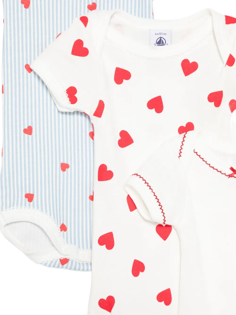 Petit Bateau Drie gestreepte rompers met hart-print Blauw