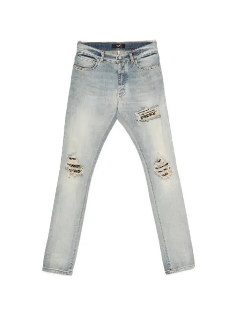 AMIRI stud-embellished distressed jeans