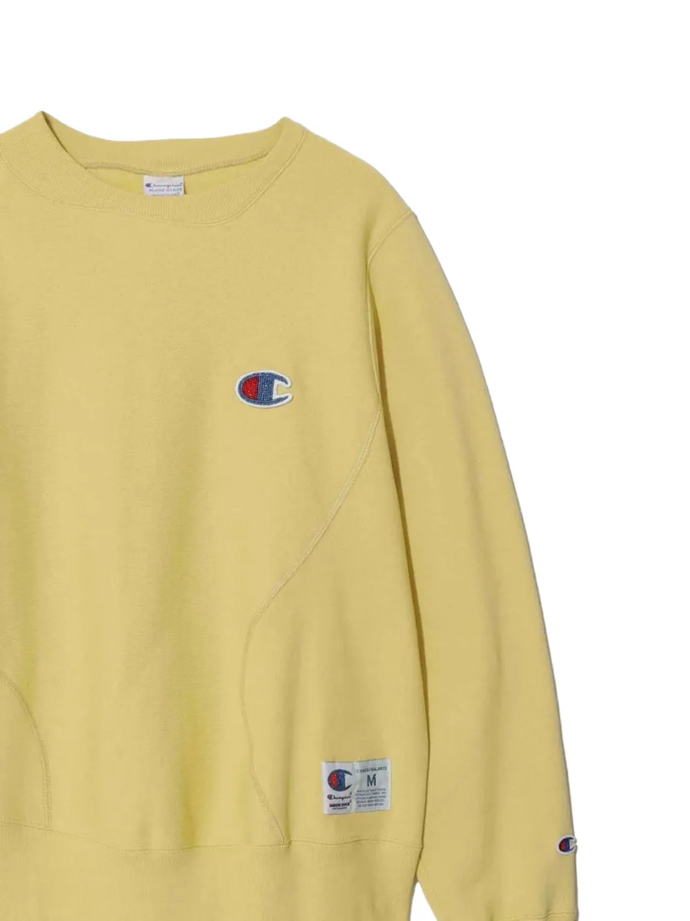 Undercover x Champion asymmetrische trui Geel