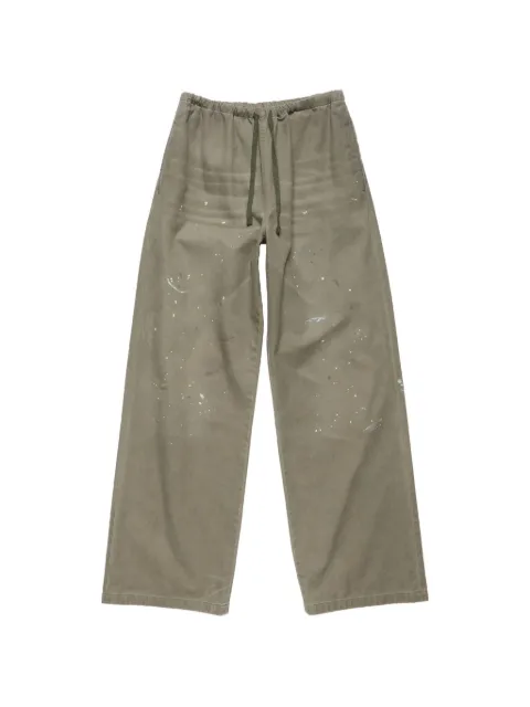 Acne Studios pantalones con motivo de salpicadura de pintura