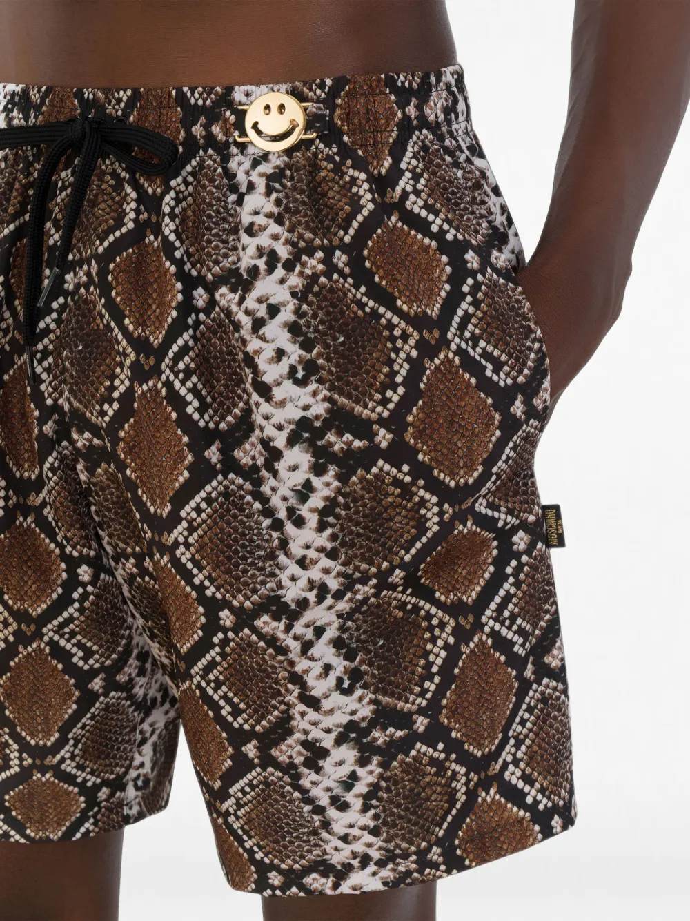 Moschino snakeskin-print Smiley swimming shorts Bruin