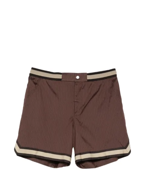CHÉ Baller pinstripe swim shorts