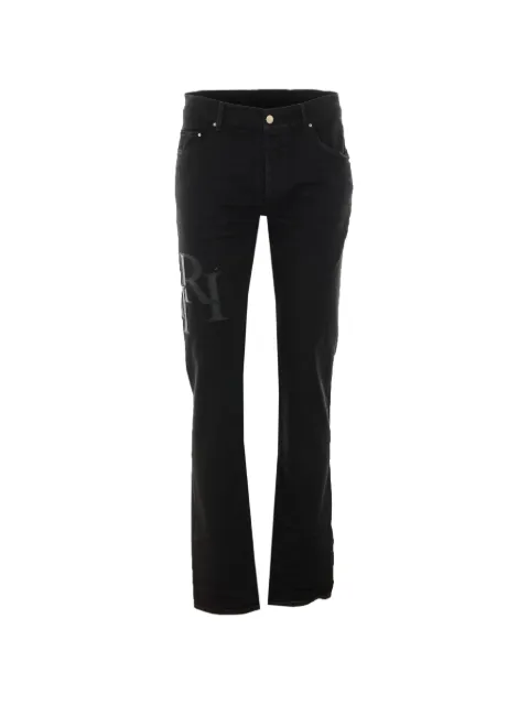 AMIRI logo-patch waxed jeans