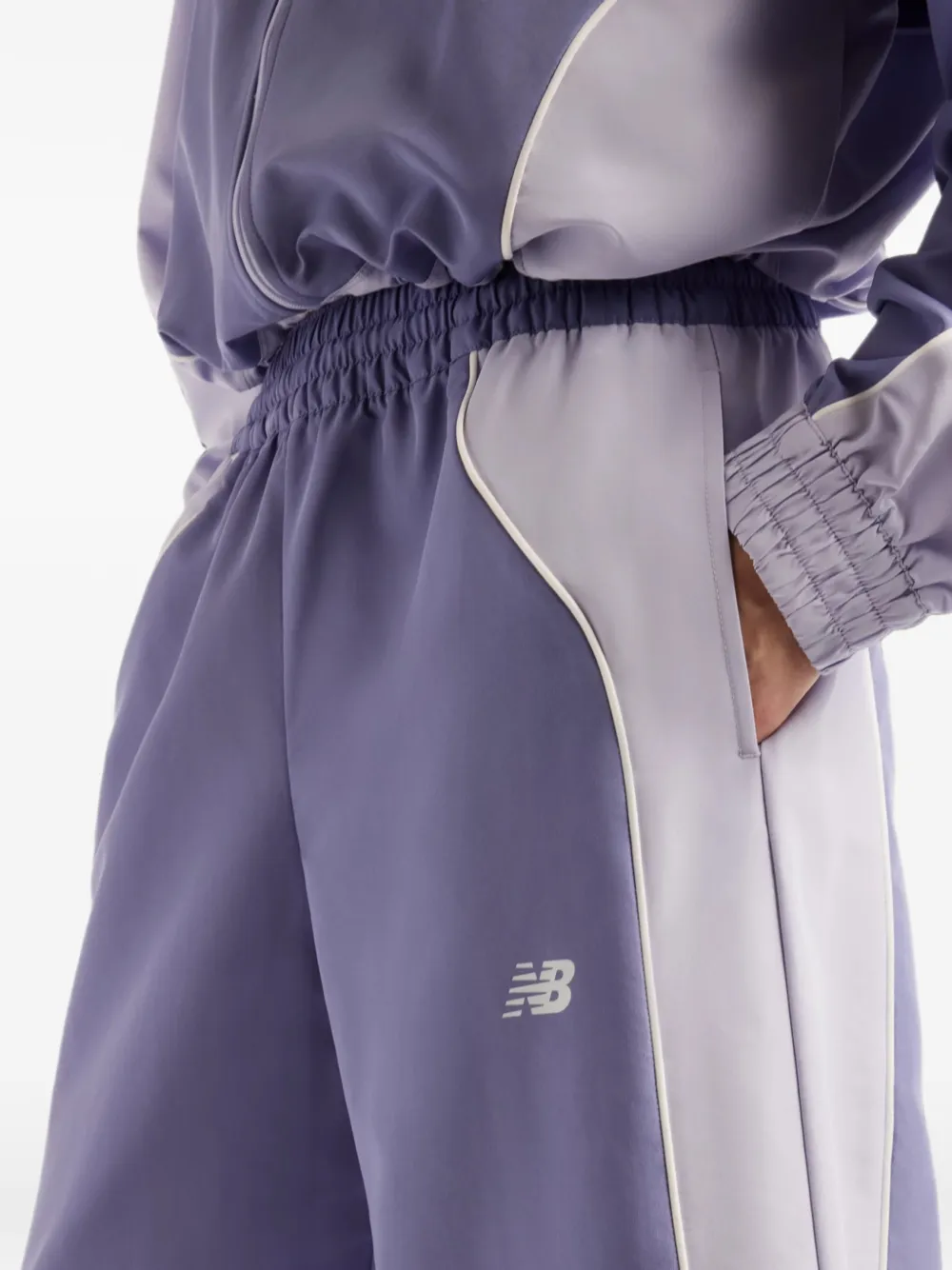 New Balance Trackside woven pants Paars