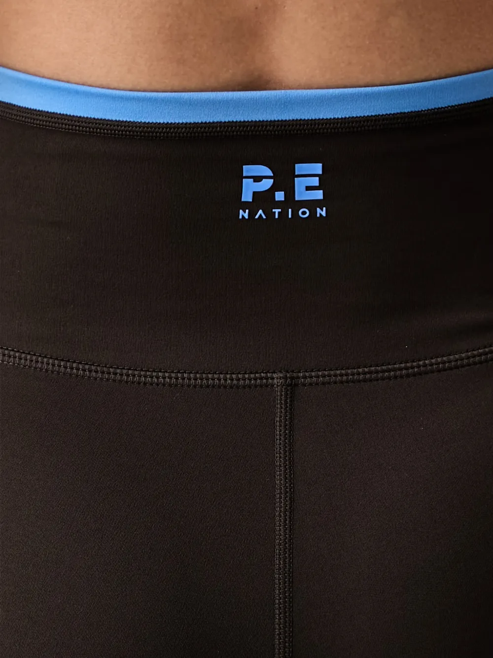 P.E Nation Vita high waist legging met logoprint Bruin