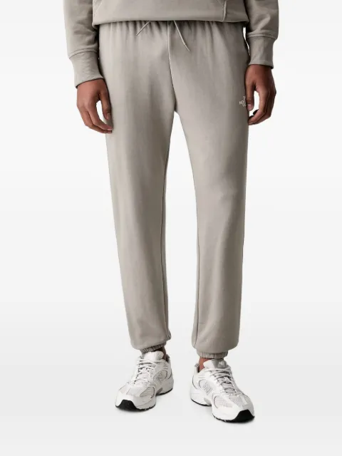 The North Face pantalon de jogging Simple Dome Light à logo imprimé et lien de resserrage