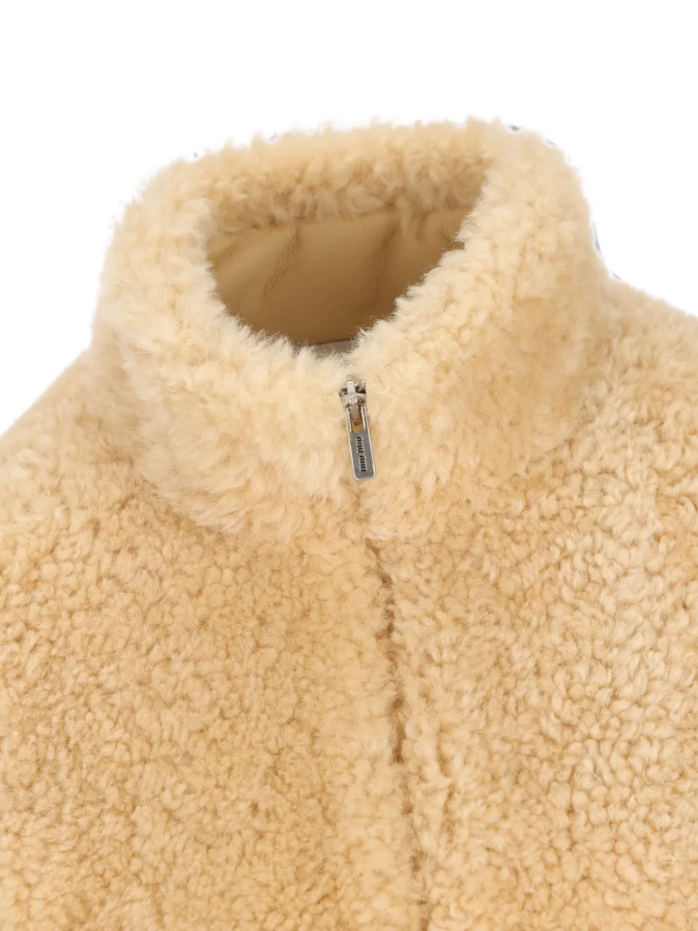 Miu Montone jack met fleece textuur en hoge hals Beige
