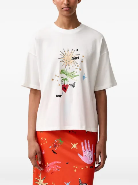 NEVER FULLY DRESSED camiseta con estampado gráfico