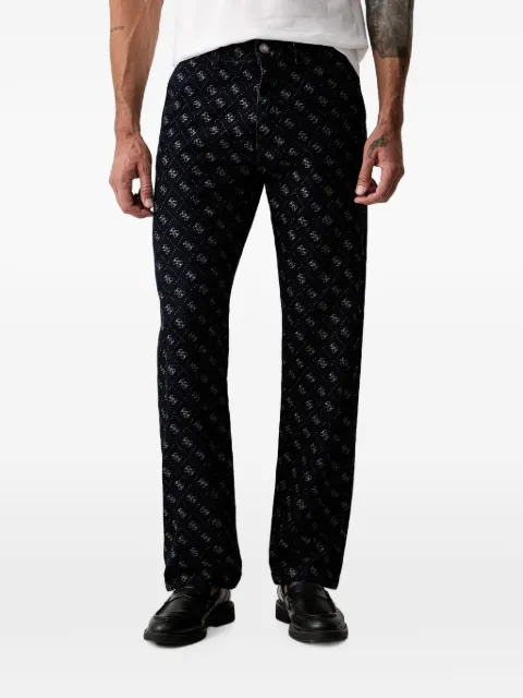 GUESS USA Damon monogram-print logo-patch jeans