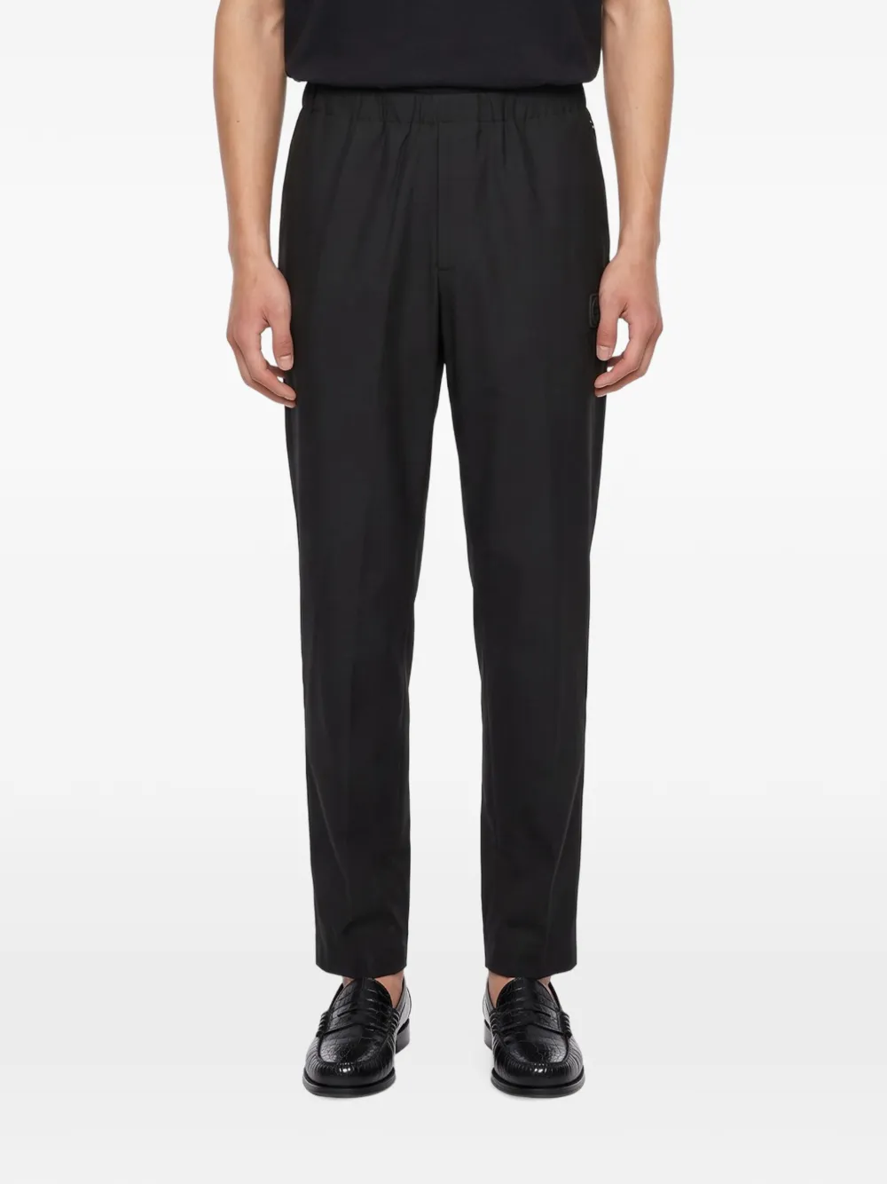 Undercover elasticated-waist logo-patch trousers Zwart