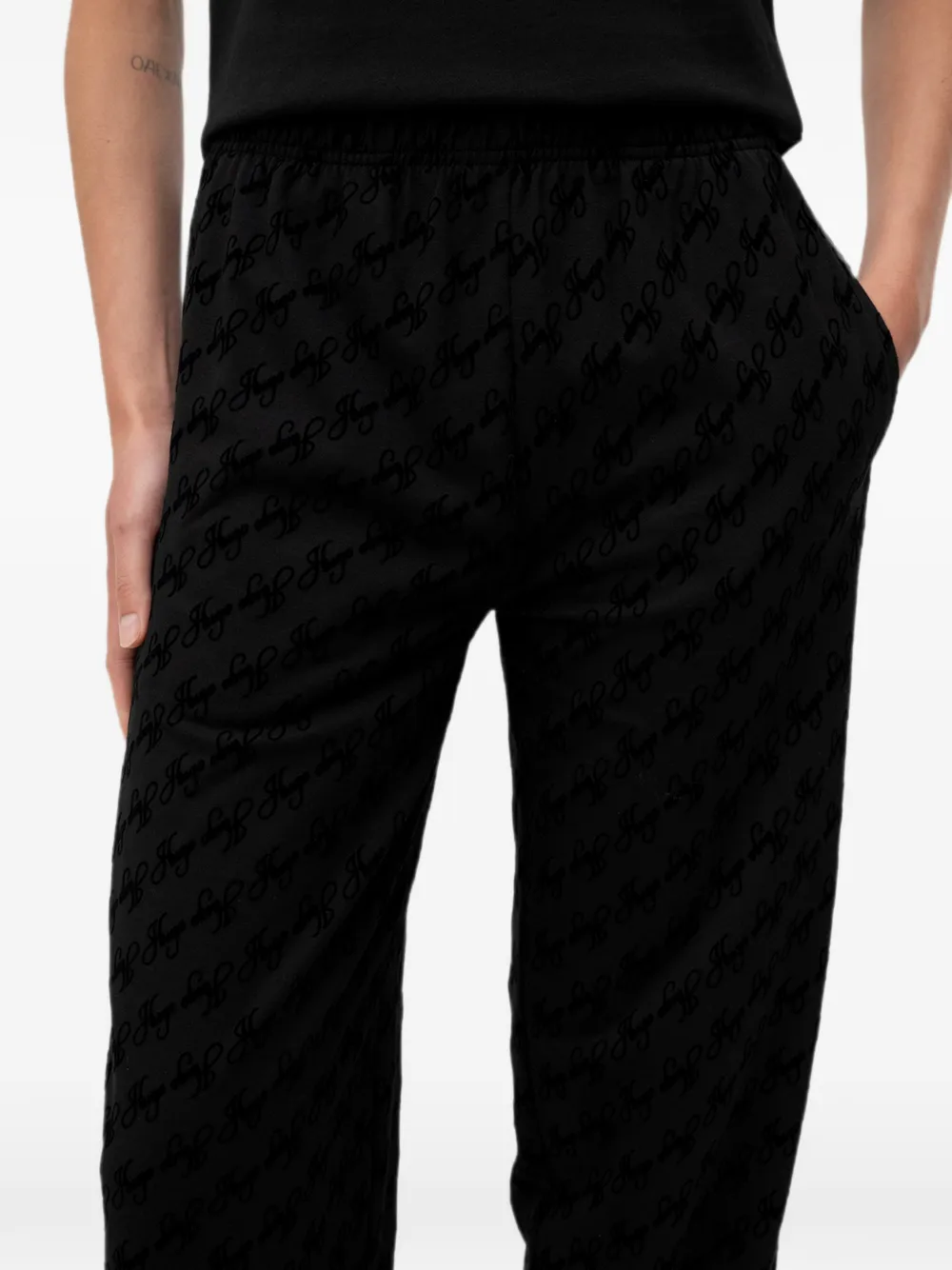 HUGO Flokky ruimvallende trainingsbroek met logo-print Zwart