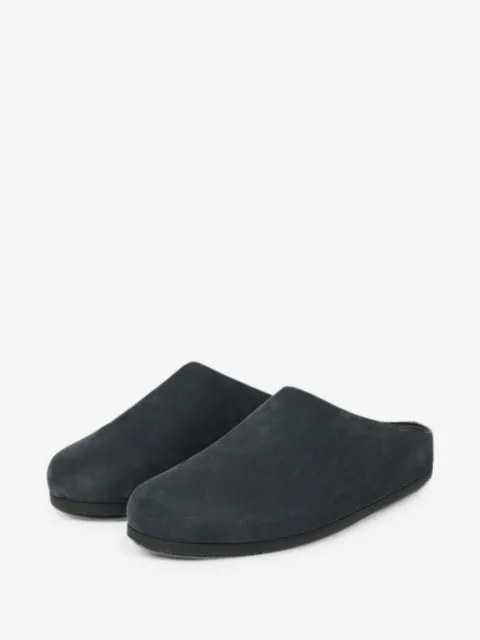 Studio Nicholson Wearing leather clogs