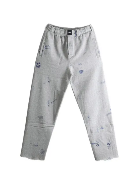 VETEMENTS scribble-print raw-edge track pants