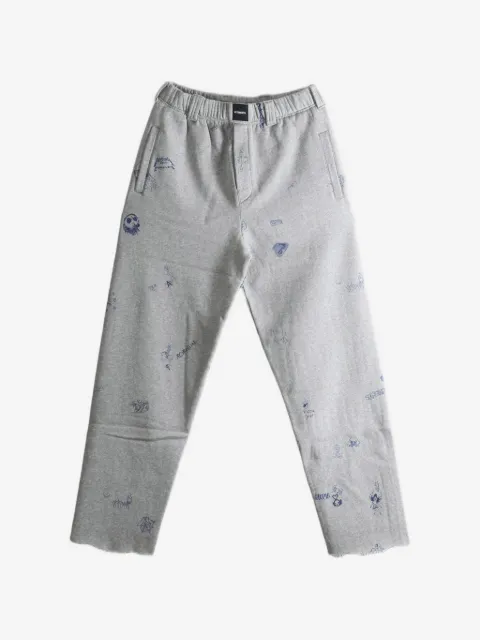 VETEMENTS scribble-print raw-edge track pants