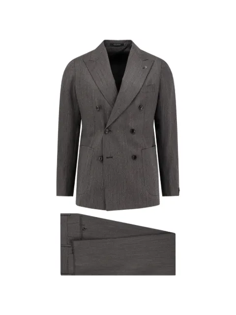 Tagliatore traje con doble botonadura