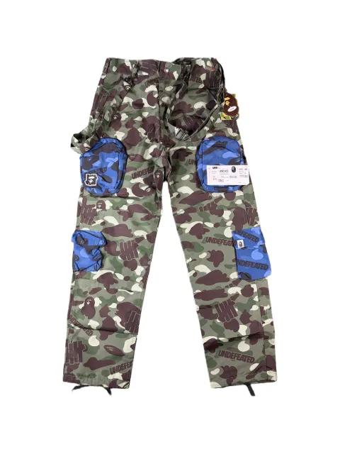 A BATHING APE® x Undefeated Multi-Pouch Camo cargo pants