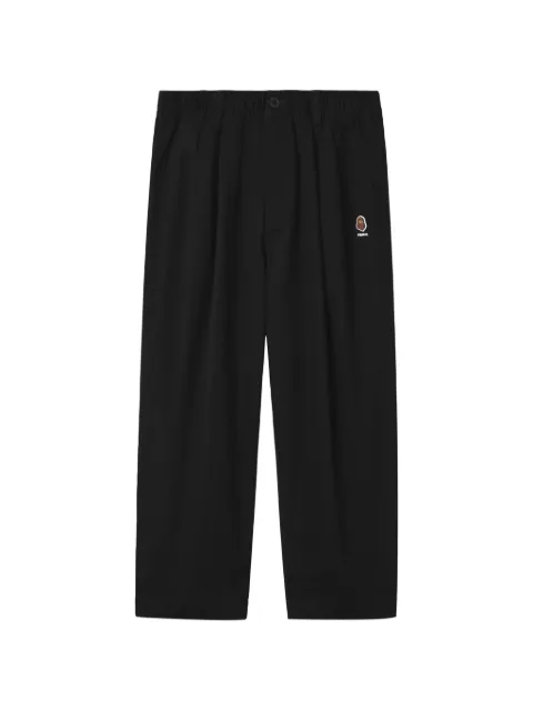FINGERCROXX logo-patch pleated trousers