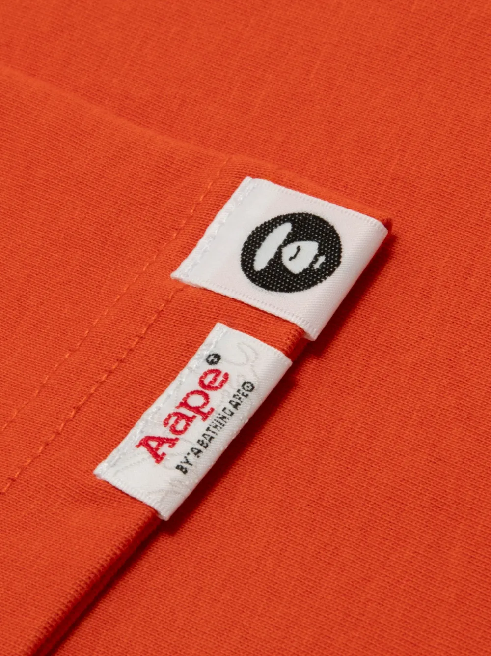 AAPE BY *A BATHING APE AAPEUNVS T-shirt met grafische print Oranje