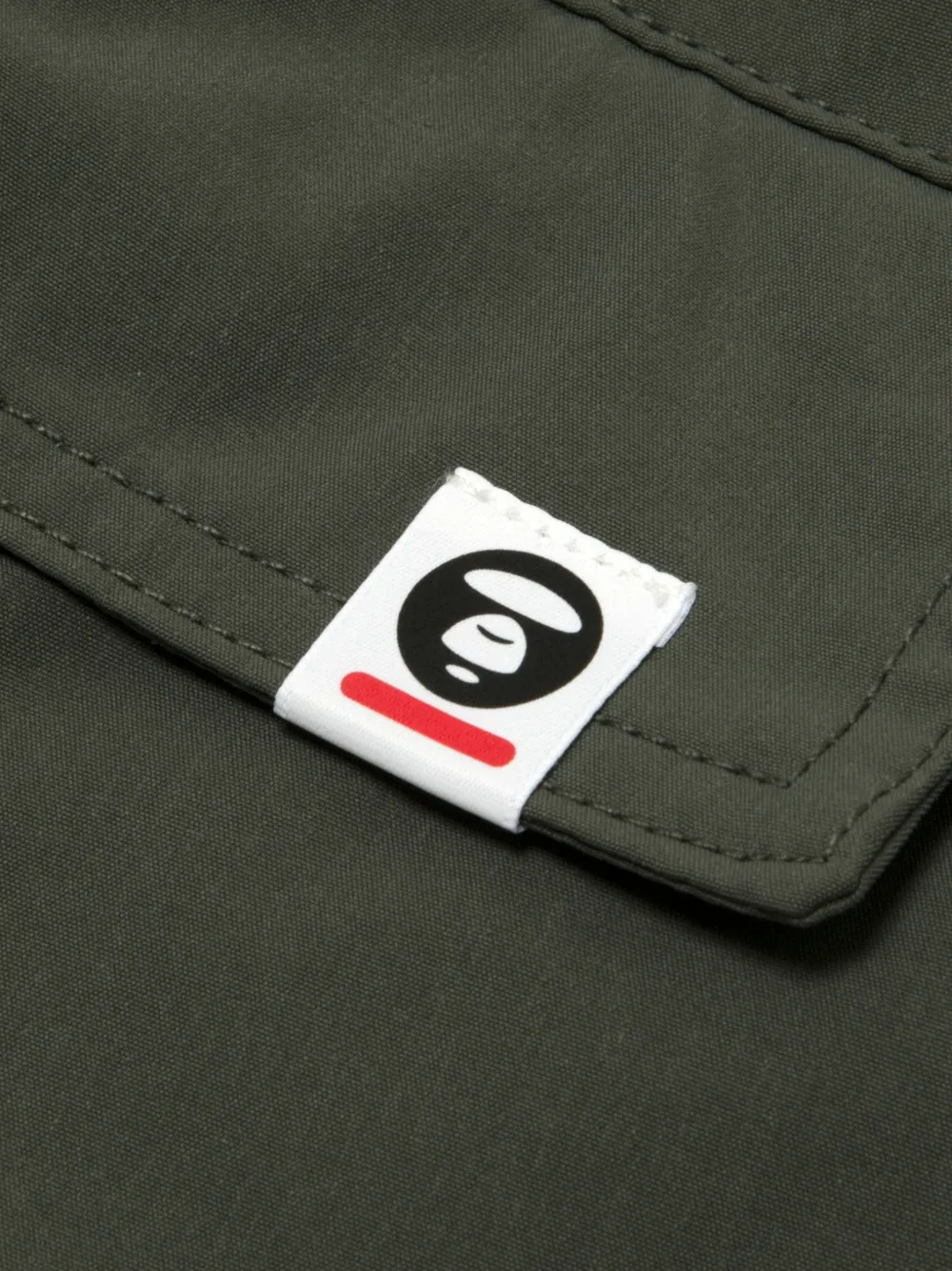 AAPE BY *A BATHING APE Trainingsbroek met toelopende pijpen en logoprint Grijs