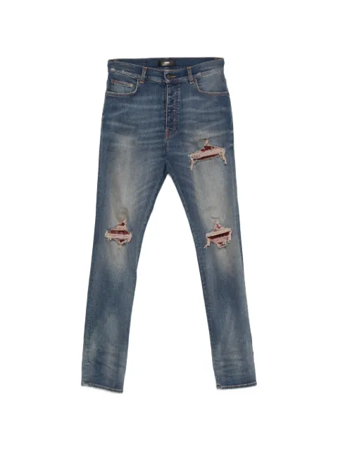 AMIRI vaqueros con efecto patchwork y diseño envejecido