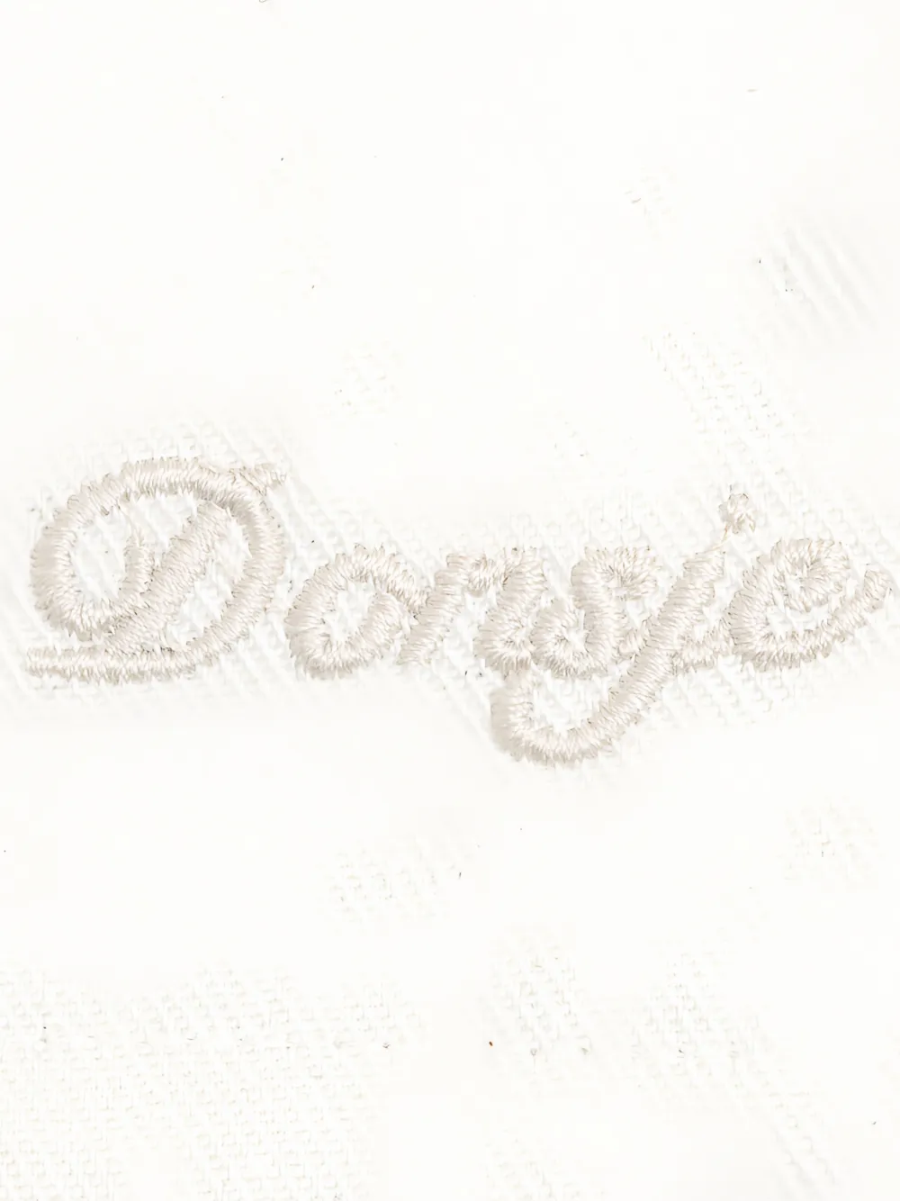Donsje Juma plooibroek met geborduurd logo Beige