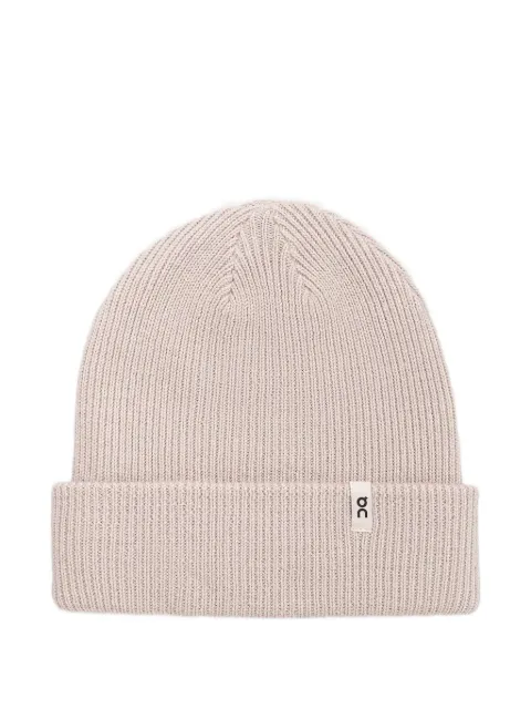 On ribbed-knit beanie hat