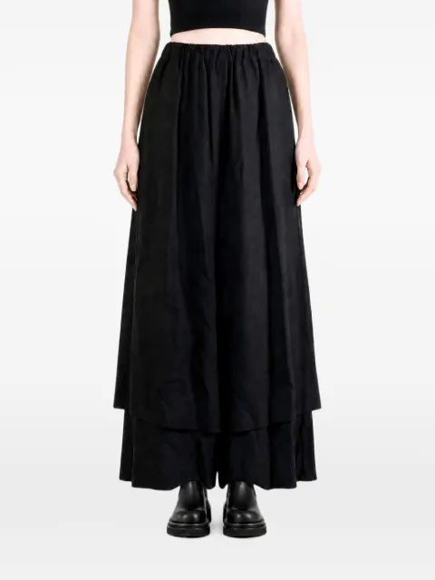 Comme Des Garçons pantalones a capas