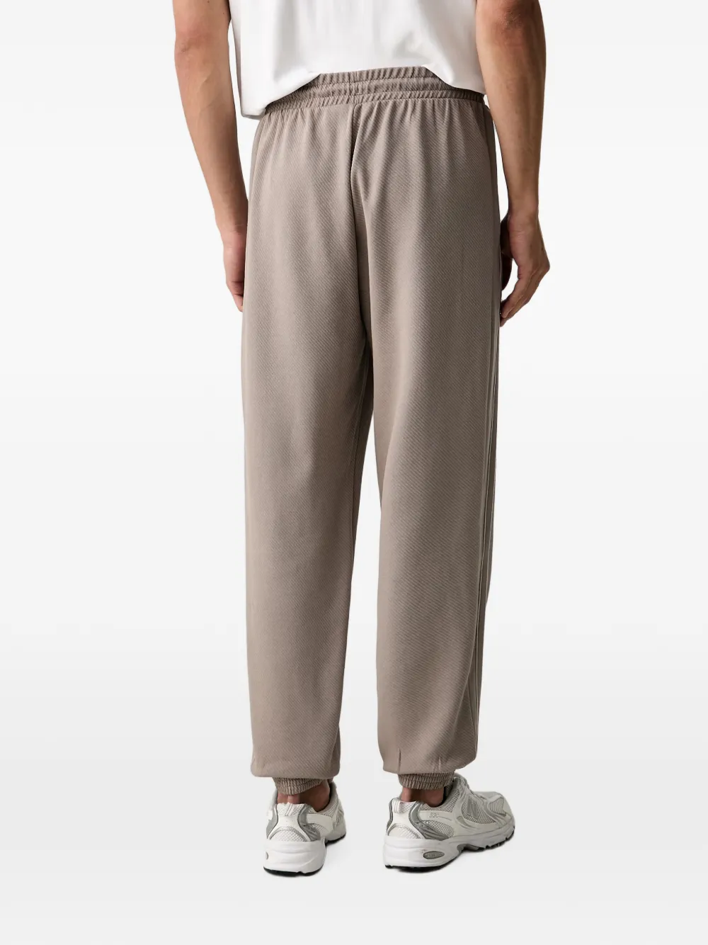PUMA Trainingsbroek met geborduurd logo Beige