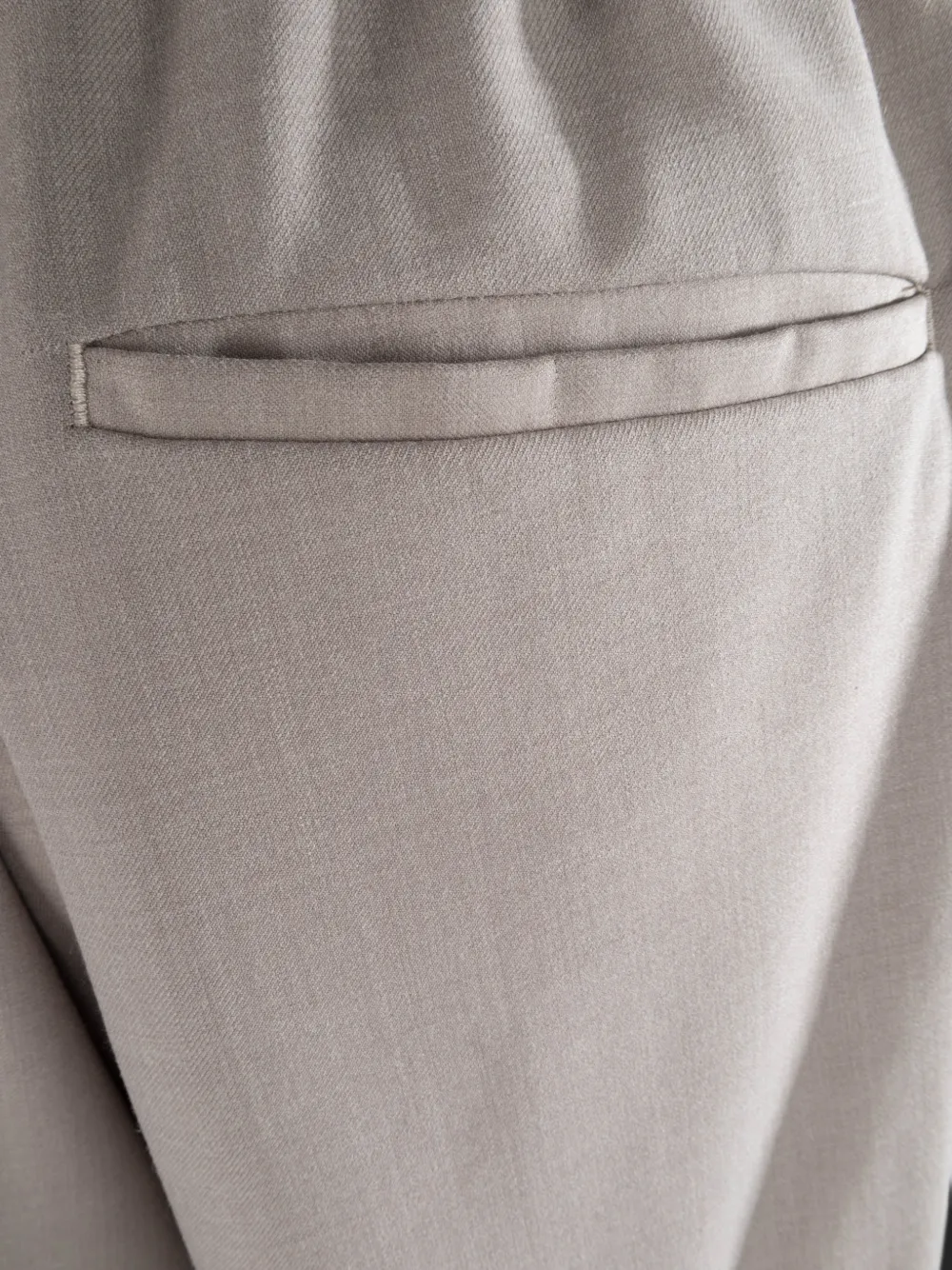Myths pleated tapered trousers Beige