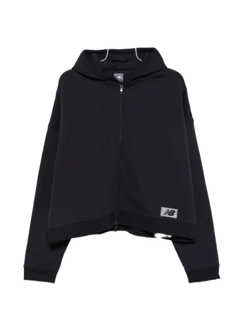 New Balance sudadera con capucha y parche del logo