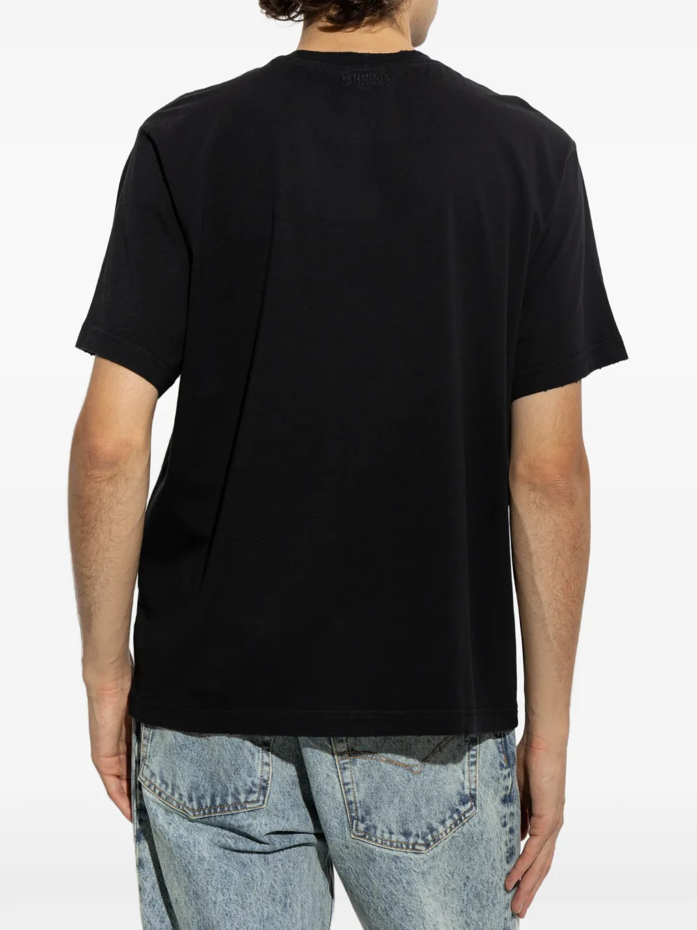 VETEMENTS Gerafeld T-shirt met tekst Zwart