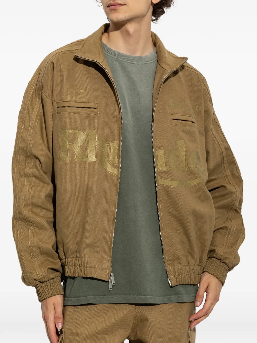 RHUDE Track jack met logoprint en rits Bruin