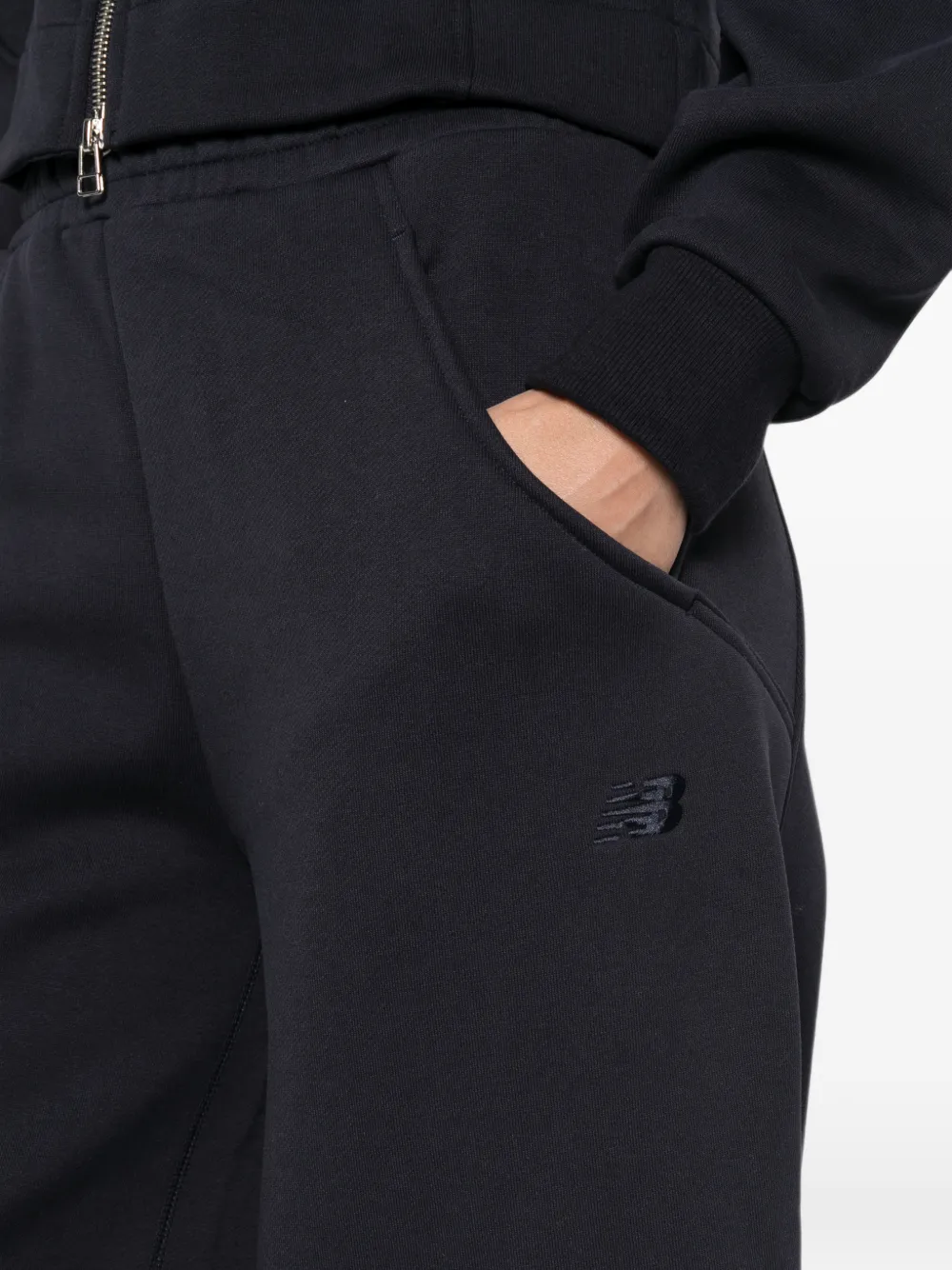 New Balance logo-embroidered track pants Blauw