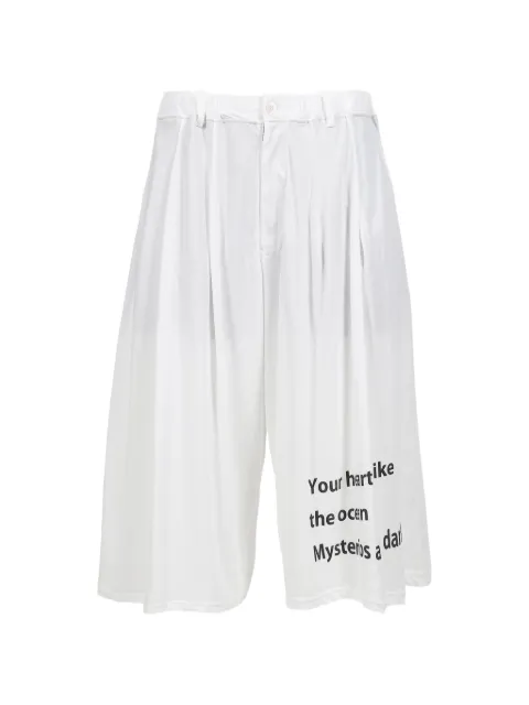Yohji Yamamoto message-print pleated shorts