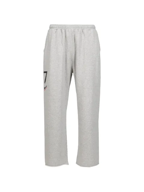 PROTOTYPES logo-print raw-cut track pants