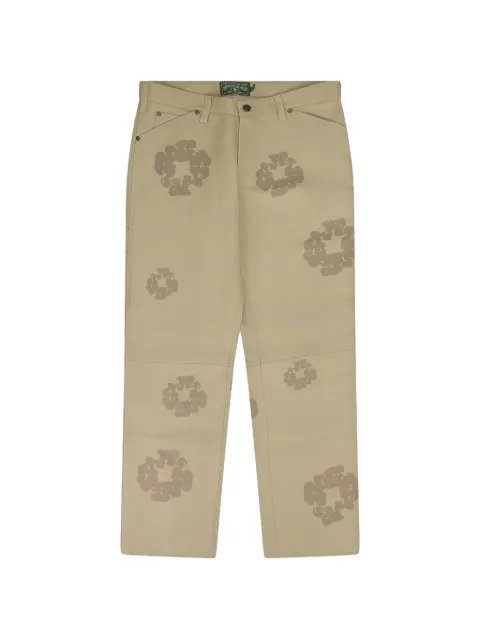 Denim Tears pantalones con cortes a láser con motivo de corona de laurel